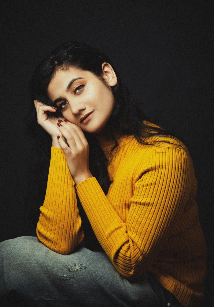Woman in a yellow sweater